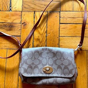 Barely used Coach clutch with crossbody strap